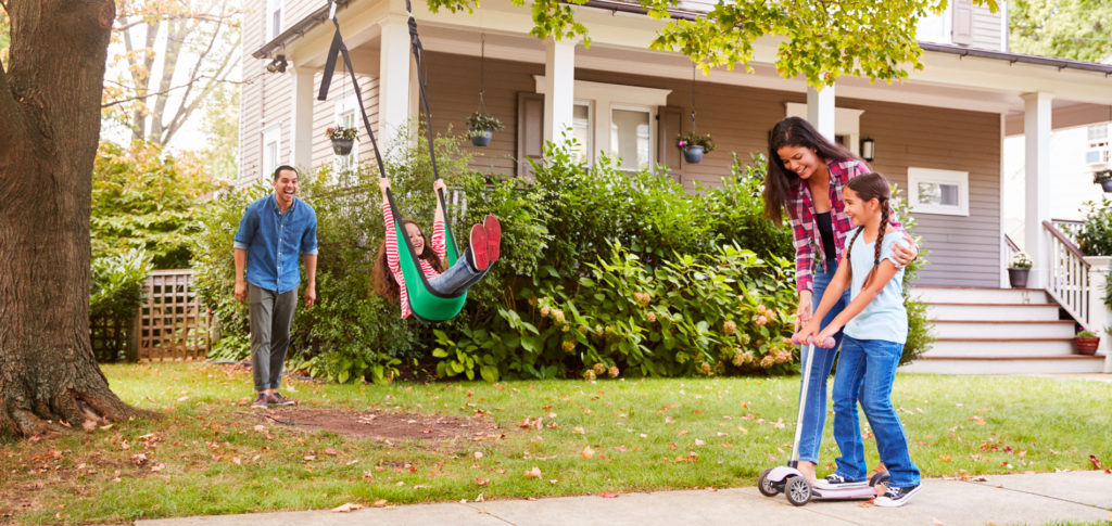 family of four enjoying activities outside to help improve mood