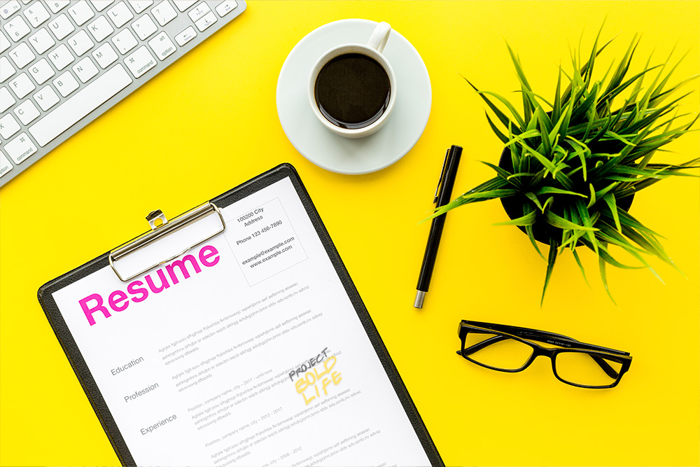 resume on a bright yellow desk - how to get your resume noticed