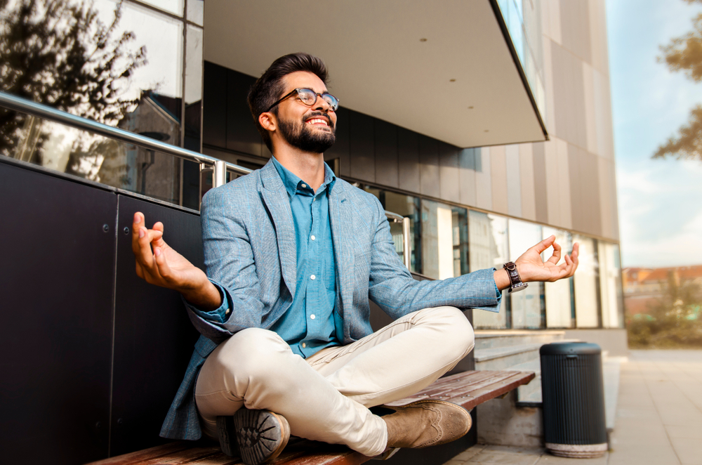 man meditating to stop negative thoughts