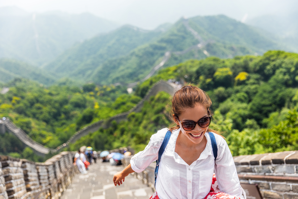respectful tourist walking on famous Great Wall of China