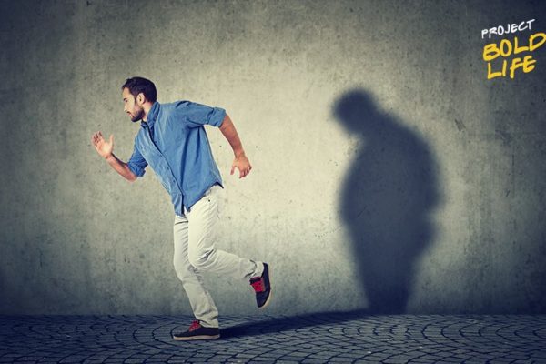 A thin dude running away from his fat shadow