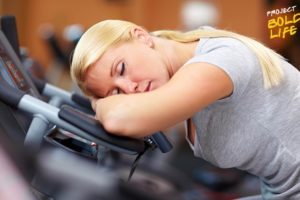 A woman snoozing on the treadmill
