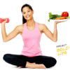 A woman about to eat a dumbell with veggies