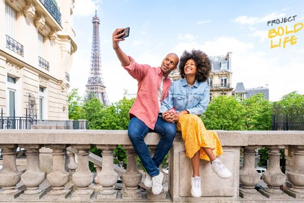 A couple taking a selfie in Paris