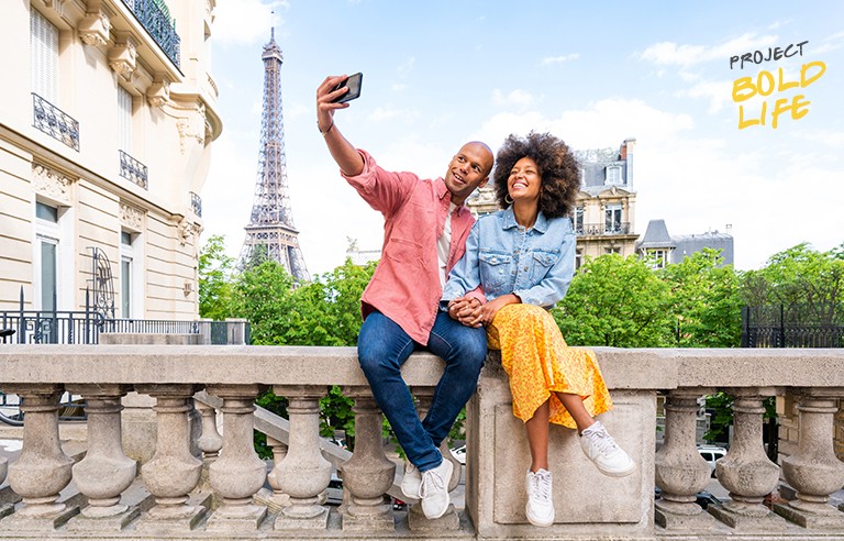 A couple taking a selfie in Paris