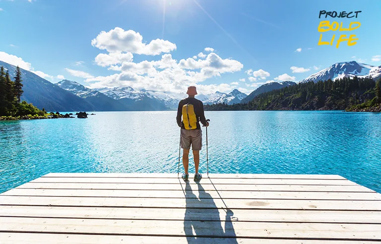 A dude in Canada standing on a dock