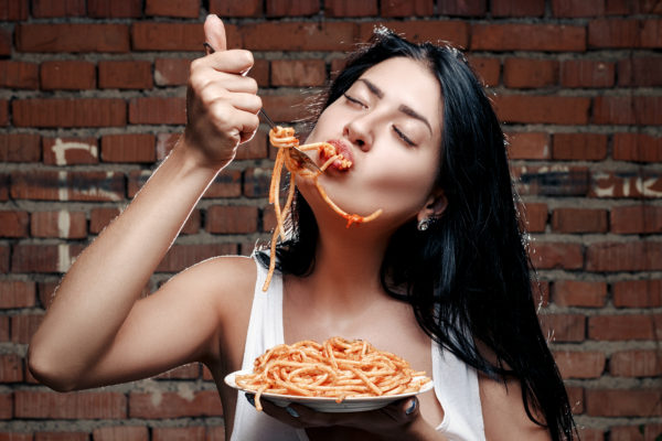 girl eating spaghetti fast