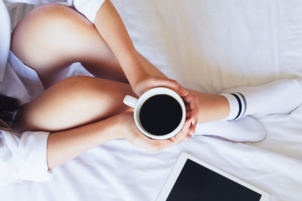 Girl holding a cup of coffee