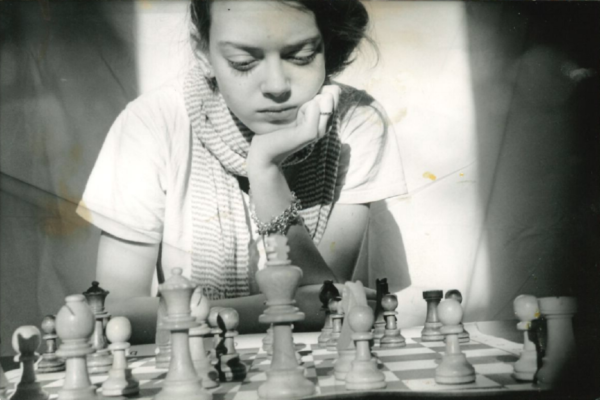 Nicole Maffeo playing chess as a young girl