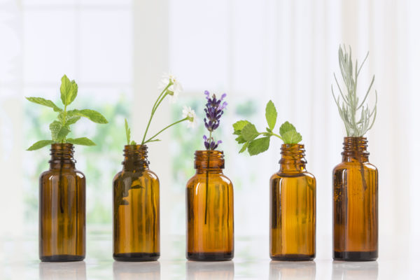 different types of essential oils in bottles