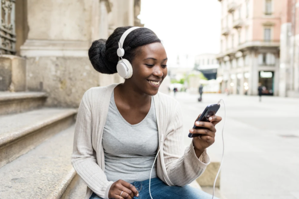 woman listening to classical music pieces on her iphone