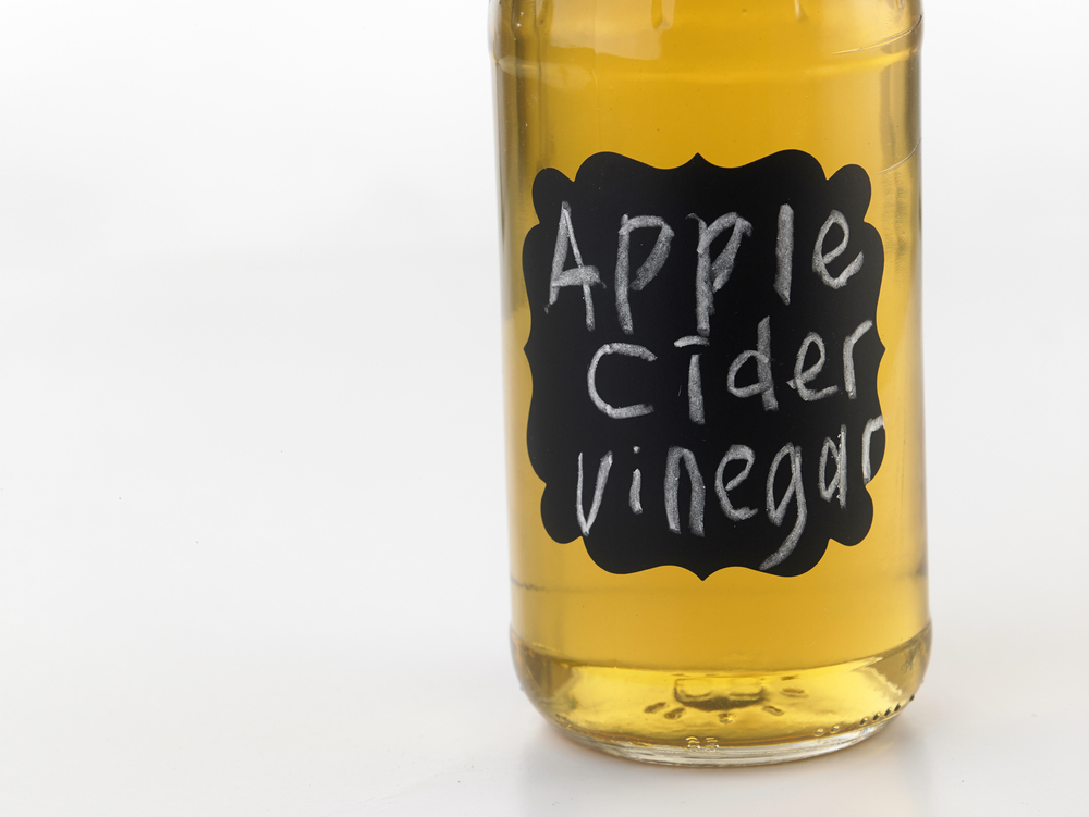 bottle of apple cider vinegar with chalkboard label