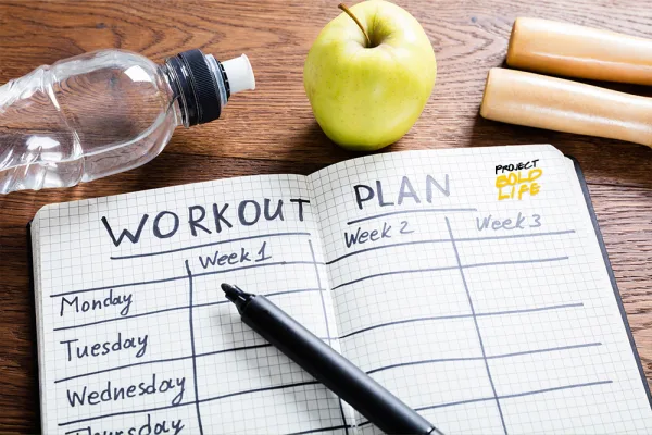 open journal that includes a weekly exercise plan for optimal health