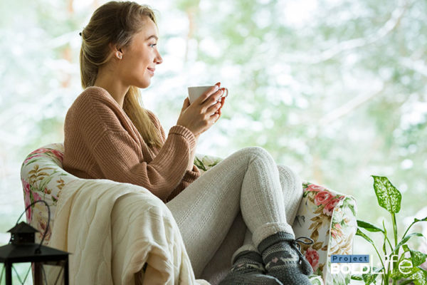 woman sipping on tea, just chilling