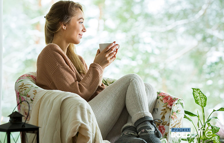 woman sipping on tea, just chilling