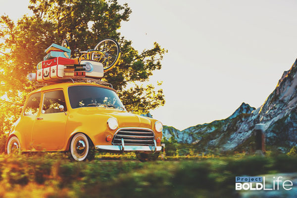 People in a tiny French car
