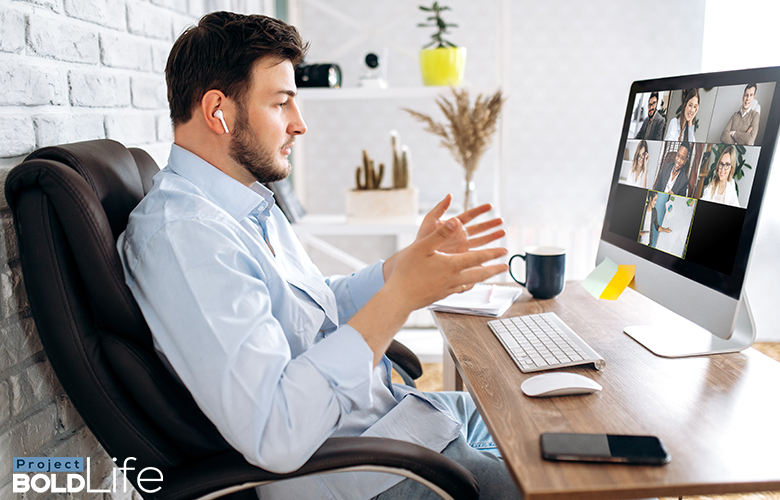 A man having a Zoom business meeting at home
