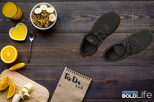 A person eating breakfast with their shoes on the table