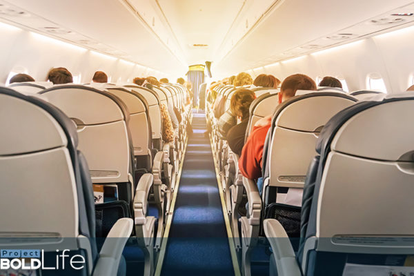 A glowing stewardess on a flight