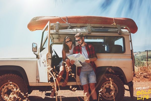 A couple gazing upon a map while hopelessly lost