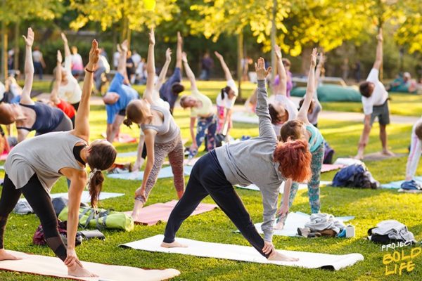 A bunch of people working out outside