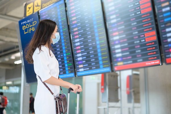 A female traveling about to embark on a journey