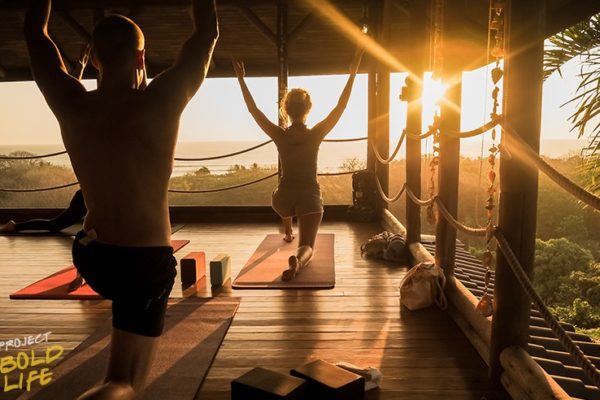 A couple doing some yoga at a retreat