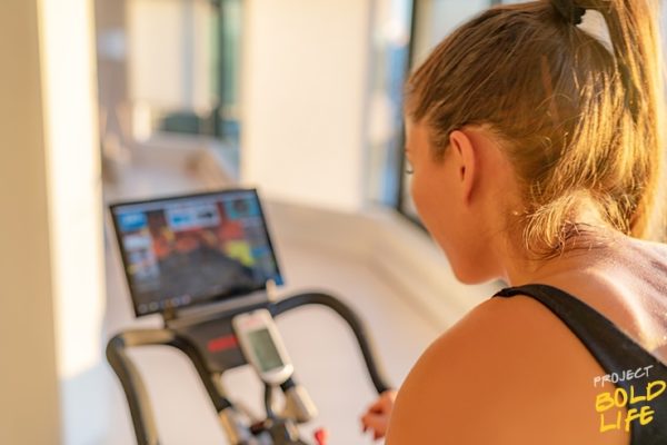 Some woman using her exercise bike to exercise