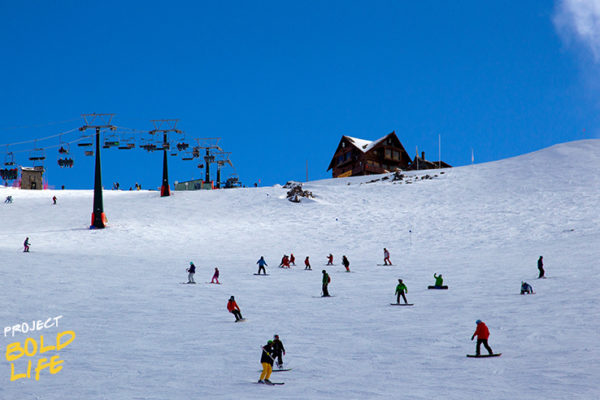 A bunch of people risking their lives on the slopes