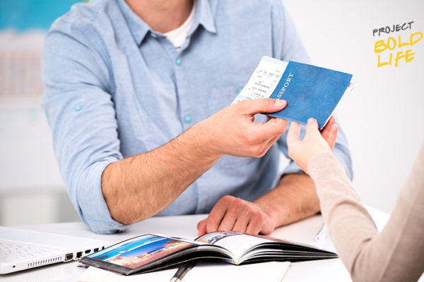 Some dude handing over his passport