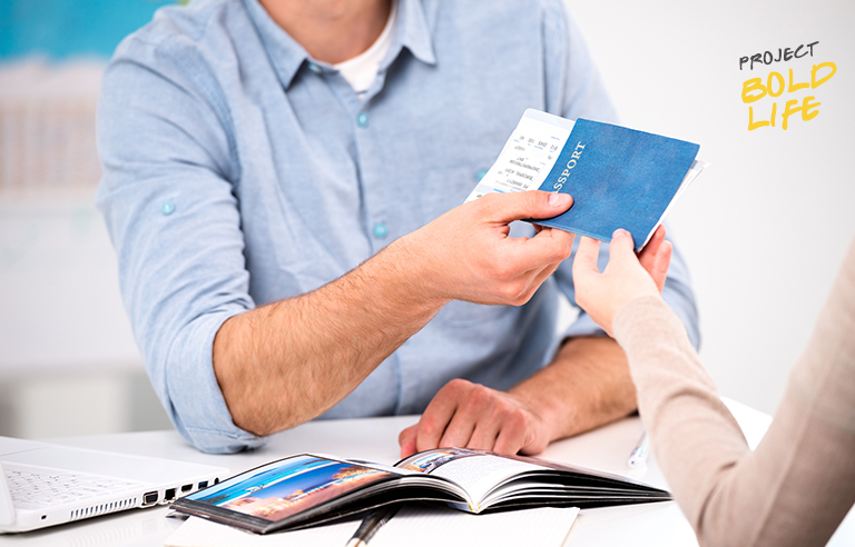 Some dude handing over his passport