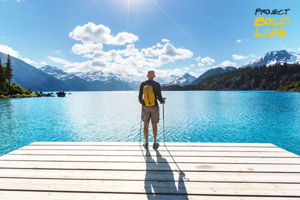 A dude in Canada standing on a dock