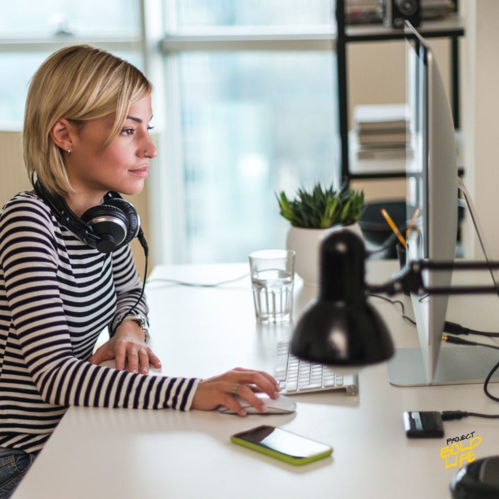 a woman reading the Top gifts for productivity 2025 list