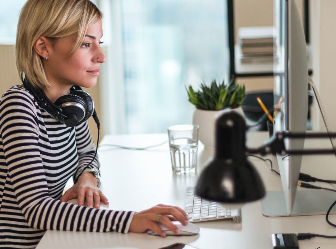 a woman reading the Top gifts for productivity 2025 list