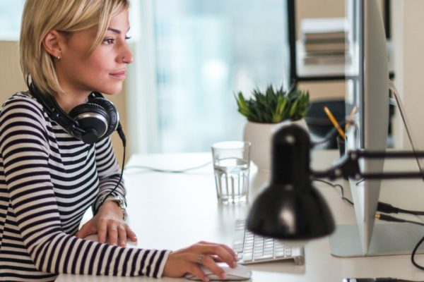 a woman reading the Top gifts for productivity 2025 list